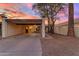 Charming single-story home with covered parking and a well-maintained yard at sunset at 2966 S Country Club Way, Tempe, AZ 85282
