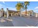 Exterior view of home with desert landscaping, covered parking, and welcoming entry at 2966 S Country Club Way, Tempe, AZ 85282