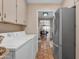 Practical laundry area with a glimpse into the adjoining kitchen and dining space at 2966 S Country Club Way, Tempe, AZ 85282
