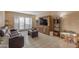 Comfortable living room features a large entertainment center and access to the patio at 2966 S Country Club Way, Tempe, AZ 85282