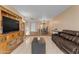 Bright and airy living room features a large entertainment center and comfortable seating at 2966 S Country Club Way, Tempe, AZ 85282