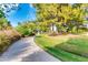 Picturesque park pathway winding through grassy areas and mature trees, perfect for leisurely strolls and outdoor enjoyment at 2966 S Country Club Way, Tempe, AZ 85282