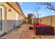 Cozy backyard patio with seating area, and access to the home through multiple entry doors at 2966 S Country Club Way, Tempe, AZ 85282