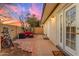 Private patio featuring brick accents, lounge seating, and multiple entry doors to the home at 2966 S Country Club Way, Tempe, AZ 85282