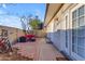 Relaxing patio area featuring stylish outdoor seating and a charming brick walkway, perfect for outdoor enjoyment and entertaining at 2966 S Country Club Way, Tempe, AZ 85282