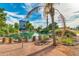 Scenic pond with clear water, mature trees, palm trees, and educational signage at 2966 S Country Club Way, Tempe, AZ 85282