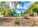 Picturesque pond scene framed by lush landscaping and rocks, with a rustic fence, creating a tranquil and inviting community space at 2966 S Country Club Way, Tempe, AZ 85282