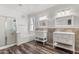 Bright bathroom featuring double vanities, soaking tub, and separate shower at 3062 E Cullumber St, Gilbert, AZ 85234