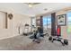 Spacious exercise room with treadmill, bike, and weightlifting equipment at 3062 E Cullumber St, Gilbert, AZ 85234