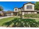 Charming two-story home featuring a well-manicured lawn and inviting front entrance with beautiful shutters at 3062 E Cullumber St, Gilbert, AZ 85234