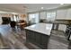 Open kitchen and dining area with a large island, modern appliances, and seamless transition to the living room at 3062 E Cullumber St, Gilbert, AZ 85234