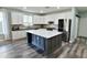 Bright kitchen featuring white cabinets, stainless steel appliances, an island, and modern finishes throughout at 3062 E Cullumber St, Gilbert, AZ 85234