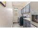 Spacious laundry room with a window, cabinets, sink, and modern appliances at 3062 E Cullumber St, Gilbert, AZ 85234