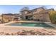 Backyard view of the pool and hot tub with a patio and seating areas at 3062 E Cullumber St, Gilbert, AZ 85234