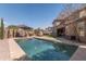 Relaxing pool with seating areas, hot tub, and a lush backyard space at 3062 E Cullumber St, Gilbert, AZ 85234