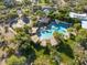 Aerial shot of community pool with shaded cabanas, basketball court, and tennis court at 3935 E Rough Rider Rd # 1076, Phoenix, AZ 85050