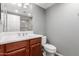 Bathroom featuring a single vanity, cabinet storage, and a toilet at 3935 E Rough Rider Rd # 1076, Phoenix, AZ 85050
