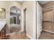 Bathroom features a large mirror, closet, and access to the bedroom with natural light at 3935 E Rough Rider Rd # 1076, Phoenix, AZ 85050