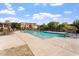 Inviting community pool surrounded by lush landscaping and comfortable lounge chairs at 3935 E Rough Rider Rd # 1076, Phoenix, AZ 85050