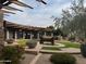 Beautifully landscaped courtyard with unique water feature and manicured greenery at 3935 E Rough Rider Rd # 1076, Phoenix, AZ 85050