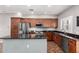 Well-lit kitchen features stainless steel appliances, granite countertops, and wood cabinetry at 3935 E Rough Rider Rd # 1076, Phoenix, AZ 85050