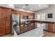 Beautiful kitchen includes stainless steel appliances, an island with granite countertops, and ample cabinet space at 3935 E Rough Rider Rd # 1076, Phoenix, AZ 85050