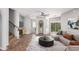 A bright, staged living room features tile floors, a ceiling fan, and staircase at 3935 E Rough Rider Rd # 1076, Phoenix, AZ 85050