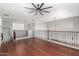 Spacious upstairs loft with hardwood floors and a ceiling fan at 3935 E Rough Rider Rd # 1076, Phoenix, AZ 85050