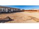 Backyard with a view of the home and fencing to offer ample privacy at 4111 N 313Th Ave, Buckeye, AZ 85396