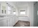Bathroom featuring double sinks, separate tub and shower, and natural light at 4111 N 313Th Ave, Buckeye, AZ 85396