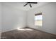 Bright bedroom with carpet, one window, and a ceiling fan at 4111 N 313Th Ave, Buckeye, AZ 85396