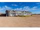 Charming single-story home featuring a well-manicured lawn and a welcoming entrance with lots of windows at 4111 N 313Th Ave, Buckeye, AZ 85396