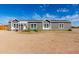 Charming single-story home featuring a well-manicured lawn and a welcoming entrance with lots of windows at 4111 N 313Th Ave, Buckeye, AZ 85396
