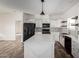 Bright kitchen with modern appliances, a large island, and an open layout at 4111 N 313Th Ave, Buckeye, AZ 85396