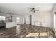 Spacious living room featuring a ceiling fan and built-in entertainment center at 4111 N 313Th Ave, Buckeye, AZ 85396