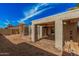 Spacious backyard featuring a covered patio, shed, and low-maintenance desert landscaping at 4116 N 105Th Ln, Phoenix, AZ 85037