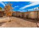 A well-kept backyard with desert landscaping and a block fence, ensuring privacy at 4116 N 105Th Ln, Phoenix, AZ 85037