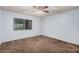 Cozy bedroom with ceiling fan and bright natural light at 4116 N 105Th Ln, Phoenix, AZ 85037