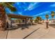 Single-story home with covered parking, desert landscaping, and mailbox with visible street number at 4116 N 105Th Ln, Phoenix, AZ 85037