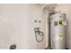 Bright laundry room with convenient hookups and a modern water heater at 4116 N 105Th Ln, Phoenix, AZ 85037