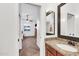 The bathroom features tile flooring, granite countertops, a large mirror and a door to another room at 4365 S Columbine Way, Gold Canyon, AZ 85118