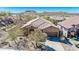 Aerial view of single-Gathering home with two-car garage and desert landscaping at 4365 S Columbine Way, Gold Canyon, AZ 85118