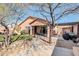 Back of home showing covered patio, outdoor kitchen, and desert landscaping at 4365 S Columbine Way, Gold Canyon, AZ 85118
