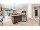 Kitchen breakfast bar with stainless steel dishwasher and a view of the living room and outdoor living space at 4365 S Columbine Way, Gold Canyon, AZ 85118