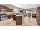 Open kitchen with a breakfast bar that flows into the living area and features stainless steel appliances at 4365 S Columbine Way, Gold Canyon, AZ 85118