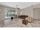 Bright living room with a ceiling fan, slider doors to the backyard, and neutral decor at 4365 S Columbine Way, Gold Canyon, AZ 85118