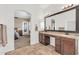 The primary bathroom boasts granite countertops, double sinks, ample storage and a private entrance to the primary bedroom at 4365 S Columbine Way, Gold Canyon, AZ 85118