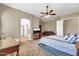 This bedroom is a serene retreat with a ceiling fan, television, sitting area, and a spa-like ensuite at 4365 S Columbine Way, Gold Canyon, AZ 85118