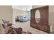 Spacious primary bedroom features neutral tones, ceiling fan, sitting area and access to the ensuite bathroom at 4365 S Columbine Way, Gold Canyon, AZ 85118