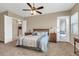 Bedroom with a ceiling fan, carpet floors and a doorway and a door leading to the outside at 4365 S Columbine Way, Gold Canyon, AZ 85118